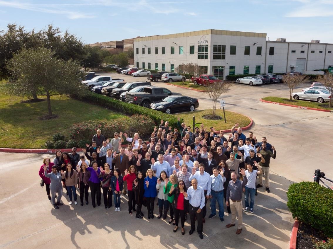 Group picture of Systel employees at the Sugar Land office.